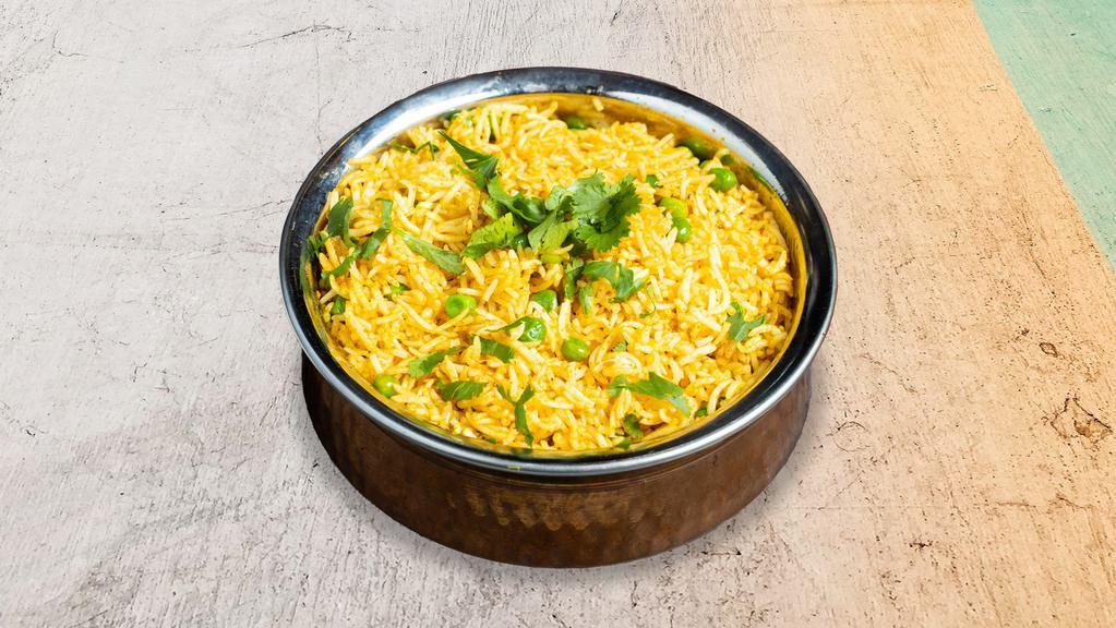 Peas Pulaou · Basmati rice cooked with fresh peas.