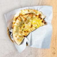 Garlic Naan · Leavened flatbread made from white flour, cooked until puffy and blistering, then coated in ...