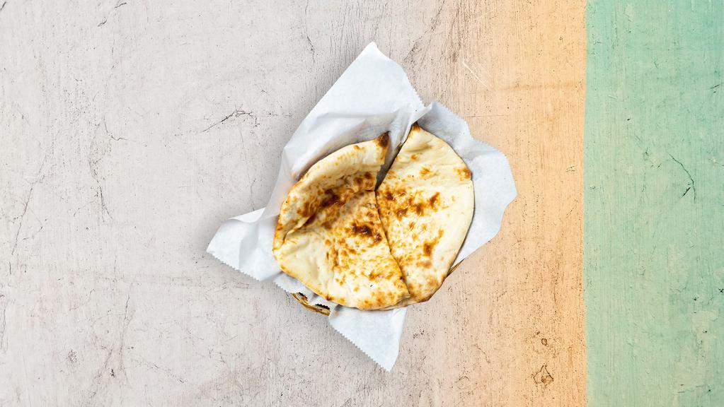 Naan · Leavened flatbread made from white flour and cooked until puffy and blistering.