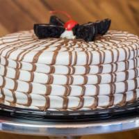 Oreo · Smooth chocolate cake, sauced with chocolate syrup, with double vanilla bavarian cream toppi...