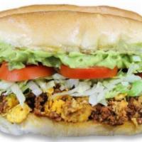Chorizo Torta · Mexican sausage with eggs, lettuce, tomato topped with guacamole.