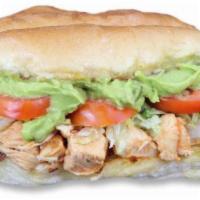 Chicken Torta · Red chili chicken topped with guacamole, tomato and lettuce.