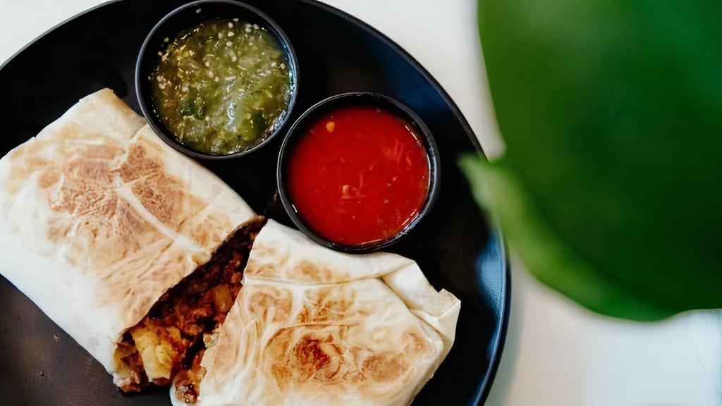 Silvia'S Famous Breakfast Burrito · Choose from pork shoulder, ground beef or potato with spinach, with four cheese blend and salsa in a flour tortilla