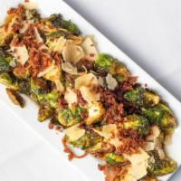 Crispy Brussel Sprouts · Fresh sprouts, applewood bacon, shaved parmesan, with truffle infused honey drizzle