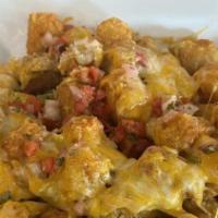 Green Chili Cheese Tots · House-made pork green chili, tater tots, cheddar & jack cheese, topped with pico & scallions.