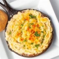 Shepherd'S Pie · House braised brisket, peas, carrots, mashed potatoes, baked in cast iron skillet, topped wi...