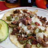Alambre · Made with either pastor asada or chicken with bacon, bel
peppers, onion layed on top of thre...