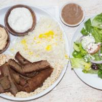 Gyro Platter · Thick slices of gyro meat served with balsamic rice, hummus and Greek salad.