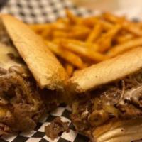 Philly Cheesesteak Sandwich · Thin slices of steak, grilled onions, mushrooms and melted cheese. Served with choice of side.