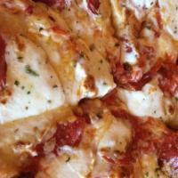  Large 14” Margarita  Pizza · Mozzarella Gorgonzola, provolone, ricotta and Parmigiano Reggiano topped with tomato and bas...