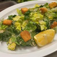 Caesar Salad · Crisp romaine, herb croutons, Parmesan cheese and Caesar dressing.