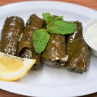 Dolma (V) · Stuffed grape leaf with Greek vinaigrette. (4).