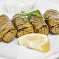 Dolma · Vegetarian stuffed grape leaf with tzatziki sauce. (4).