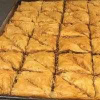 Baklava · Flaky filo filled with pistachios and honey lemon syrup.