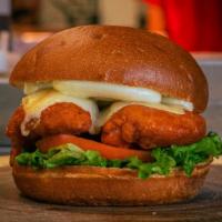 Buffalo Bill · Tommy skipped the burger on this one, crispy chicken smothered in buffalo sauce topped with ...