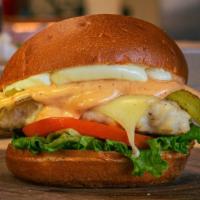 The Fat Connie (Conrad: Founding Burly Boy) · Grilled chicken topped with lettuce, tomato, whole green chili pepper, jack cheese, and chip...