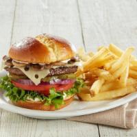 Mushroom Swiss Burger · A juicy burger patty topped with Swiss cheese and sautéed mushrooms, lettuce, tomatoes, red ...