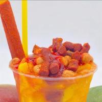 Mangoneada · Shaved ice with chamoy, tajin, mango syrup, and diced fresh mango with a tamarind stick.