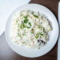 Curd Rice · Basmati rice steamed and tempered with onion cumin and mustard seeds in a yogurt / sauce.