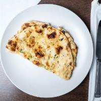 Garlic Naan · White bread baked in tandoor and topped with garlic.