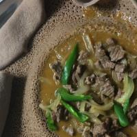 Beef Tibs · Beef pieces cooked with onions, Jalapeños and butter.