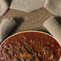 Yetefeche Awaze Tibs · Ground beef with home-made hot sauce, onion, tomato, garlic and jalapeño.
