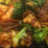 Triple Delight · Beef, Jumbo shrimp, tender white meat chicken sautéed in garden vegetable in chef's brown sa...