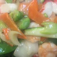 Seafood Delight · Jumbo shrimp, fresh scallop, squid, crabmeat, and vegetable in white sauce. Served with whit...