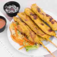 Chicken Satay (5) · Grilled marinated chicken in skewers; served with peanut sauce and cucumber salad.