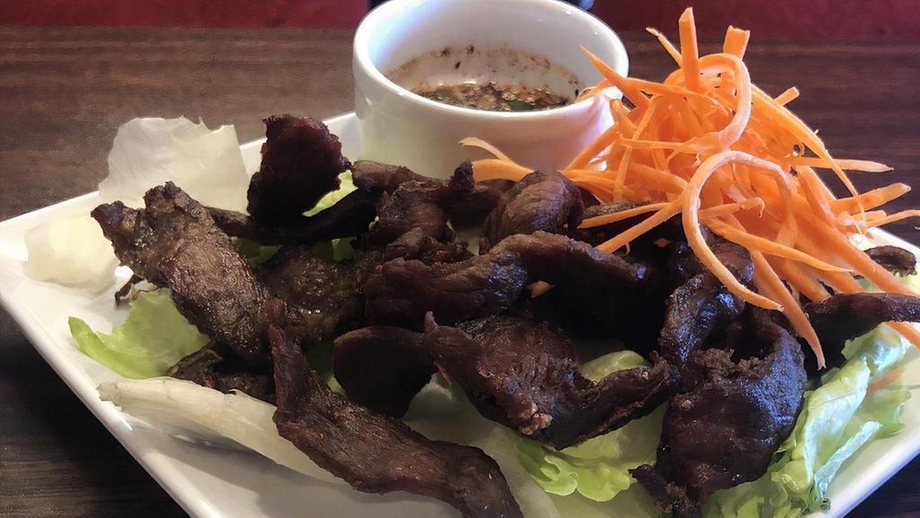 Thai Beef Jerky · Fried marinated beef jerky served with spicy thai style sauce.