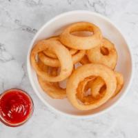 Onion Rings · Thick-cut onion rings, double dipped in beer batter for extra crunch