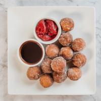Fresh Donut Holes · Irresistible and fluffy, made fresh and served with chocolate or strawberry dipping sauce.