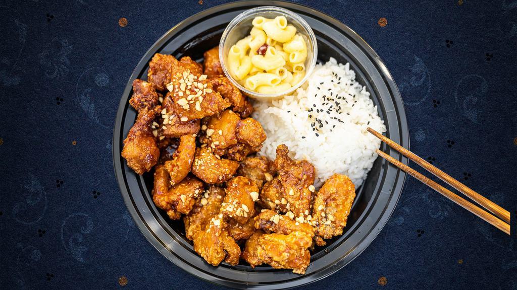 Finest Fried Chicken Bowl · Crunchy, crispy fried chicken glazed in your choice of sauce piled high over fresh white rice and topped with crushed peanuts. Served with macaroni.
