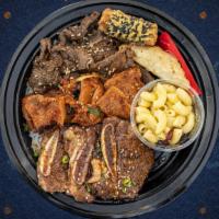 Three'S Company Bowl  · When you want to have it all. Our house marinated and grilled Kalbi (beef ribs), spicy pork ...