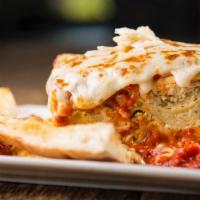 Lasagna · Homemade from the family recipe: layers of ribbon noodles and three cheeses,smothered in mar...