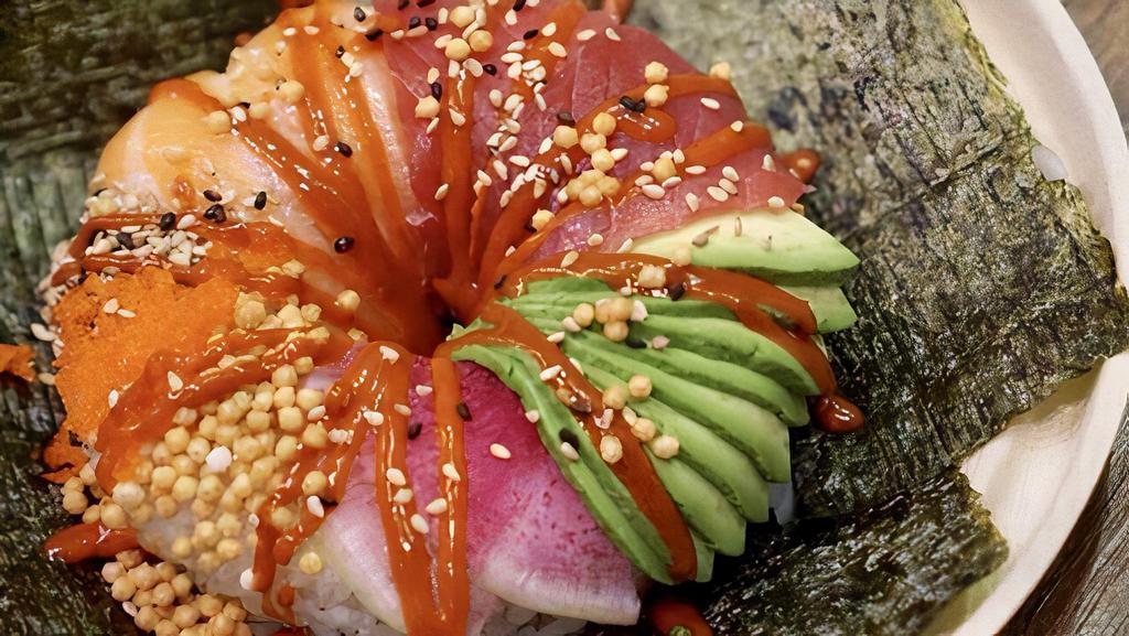 Sushi Donut · Rice donut with salmon, fish eggs, cucumber, crab meat avocado, sesame seed.