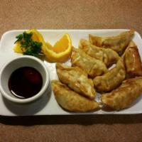 Pot Stickers · Deep fried dumpling stuffed with ground pork and vegetables, served with our homemade specia...