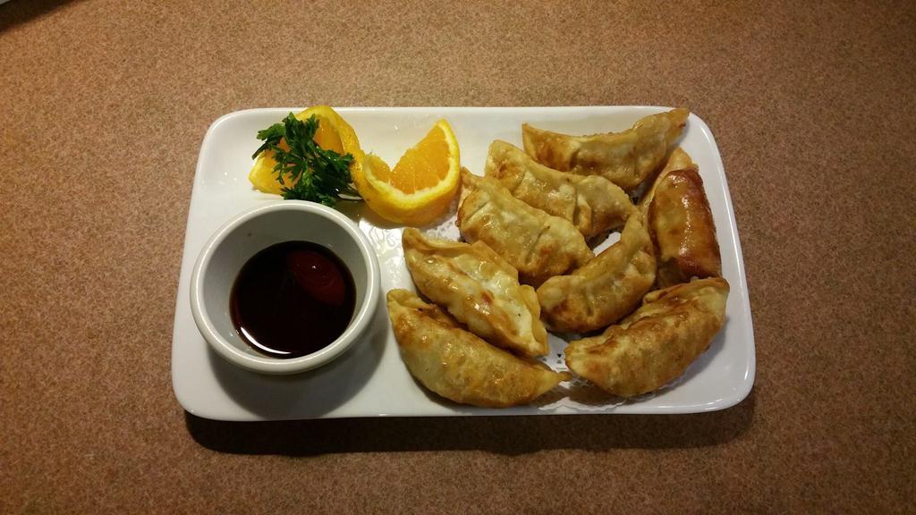 Pot Stickers · Deep fried dumpling stuffed with ground pork and vegetables, served with our homemade special ginger soy sauce.