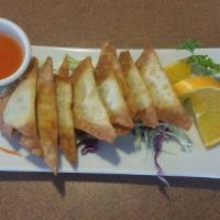 Fried Wonton · Deep fried marinated ground chicken wrapped in wonton skin, served with sweet & sour sauce.