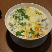 Tom Kha (Large) · Hot and sour creamy Thai coconut milk soup with a touch of lime juice, lemongrass, galangal ...