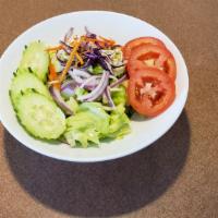 Cucumber Salad · Lettuce sliced thin cucumber topped with red onions sesame seed in house vinaigrette dressing