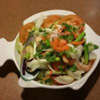 Seafood Salad (Yum Talay) · Quick boiled combination seafood, mixed with fresh chili, red onions, green onions, cilantro...