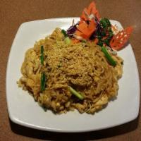 Pad Thai · Most famous stir fried Thai rice noodles with egg, bean sprouts and green onions, topped wit...