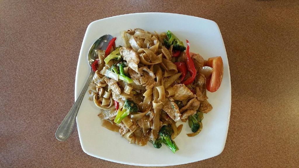 Pad Kee Mao (Drunken Noodles) · Stir fried wide rice noodles with chili, bell pepper, onions, broccoli, tomatoes and basil leaves.