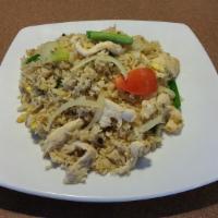 Thai Fried Rice · Stir fried steamed jasmine rice with egg, onions, tomatoes, green onions.