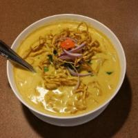 Khao Soi Chicken · Steamed yellow noodles, shallots, chili paste with coconut milk. Topped with crispy egg nood...