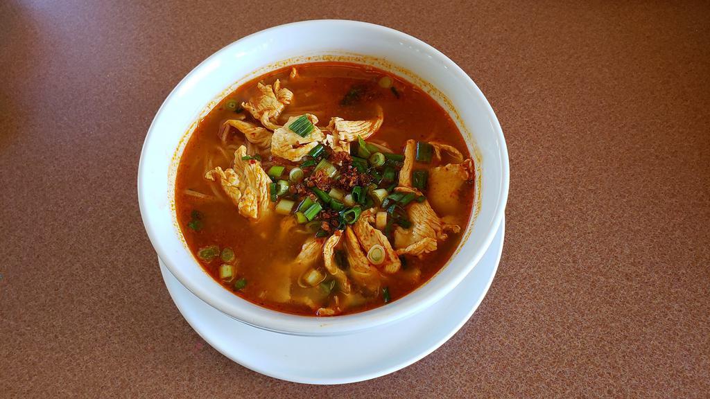 Tom Yum Noodle Soup · Rice noodles with BBQ pork, ground pork, ground peanuts, and chili lime sauce.