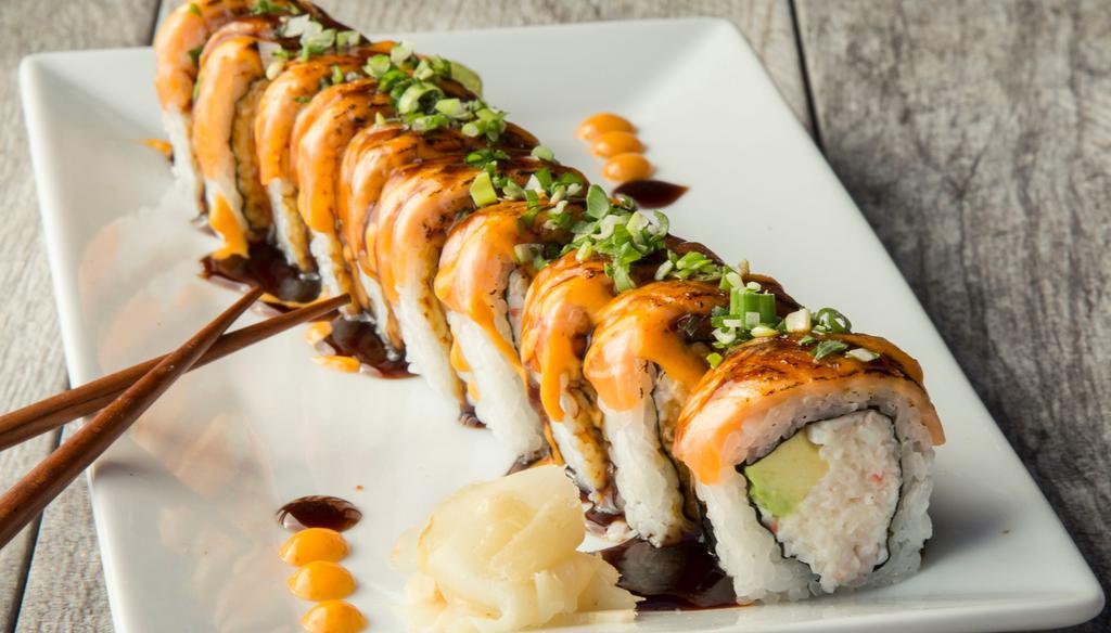 Lion King Roll · Crabmeat and avocado inside, torch seared salmon on top with dynamite sauce (10 pieces)