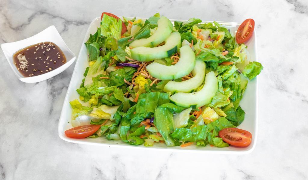 Small Garden Salad · Crisp salad with romaine lettuce, red cabbage, julienned carrots, sliced cucumbers and grape tomatoes