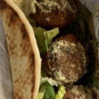 Falafel · Vegetarian. Deep fried patties of ground chick peas mixed with herbs and spices with onion, ...